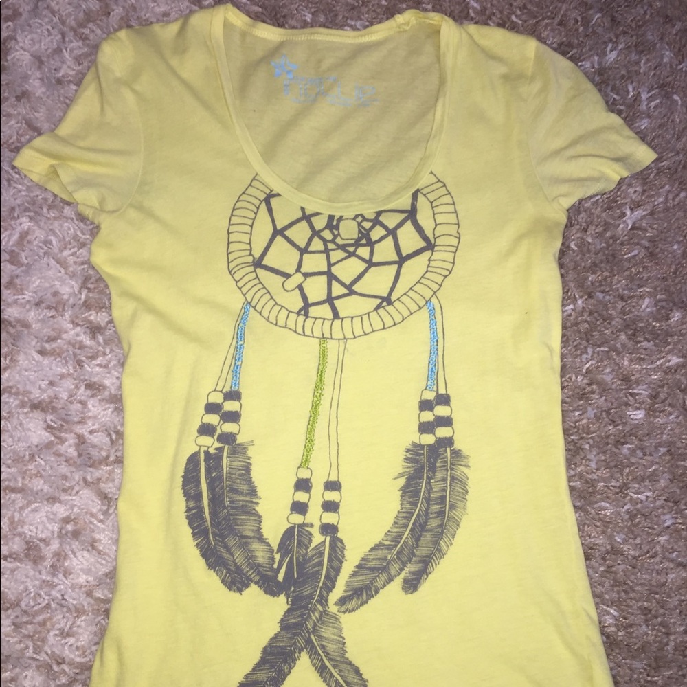 Yellow tee with tribal picture on front